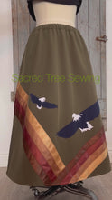 Load and play video in Gallery viewer, 360 View Green rain skirt fabric with two appliquéd eagles with golden and brown ribbons