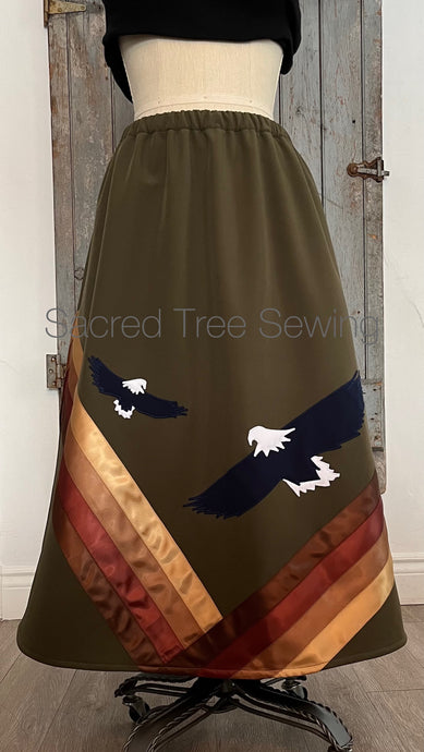 Front View Green rain skirt fabric with two appliquéd eagles with golden and brown ribbons