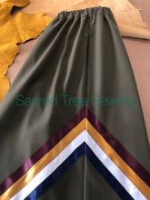 Load image into Gallery viewer, Pocket View, Green rain skirt with maroon, gold, white and navy ribbons
