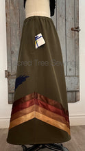 Load image into Gallery viewer, Pocket view Green rain skirt fabric with two appliquéd eagles with golden and brown ribbons
