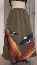 Load and play video in Gallery viewer, 360 View Green rain skirt fabric with two appliquéd eagles with golden and brown ribbons
