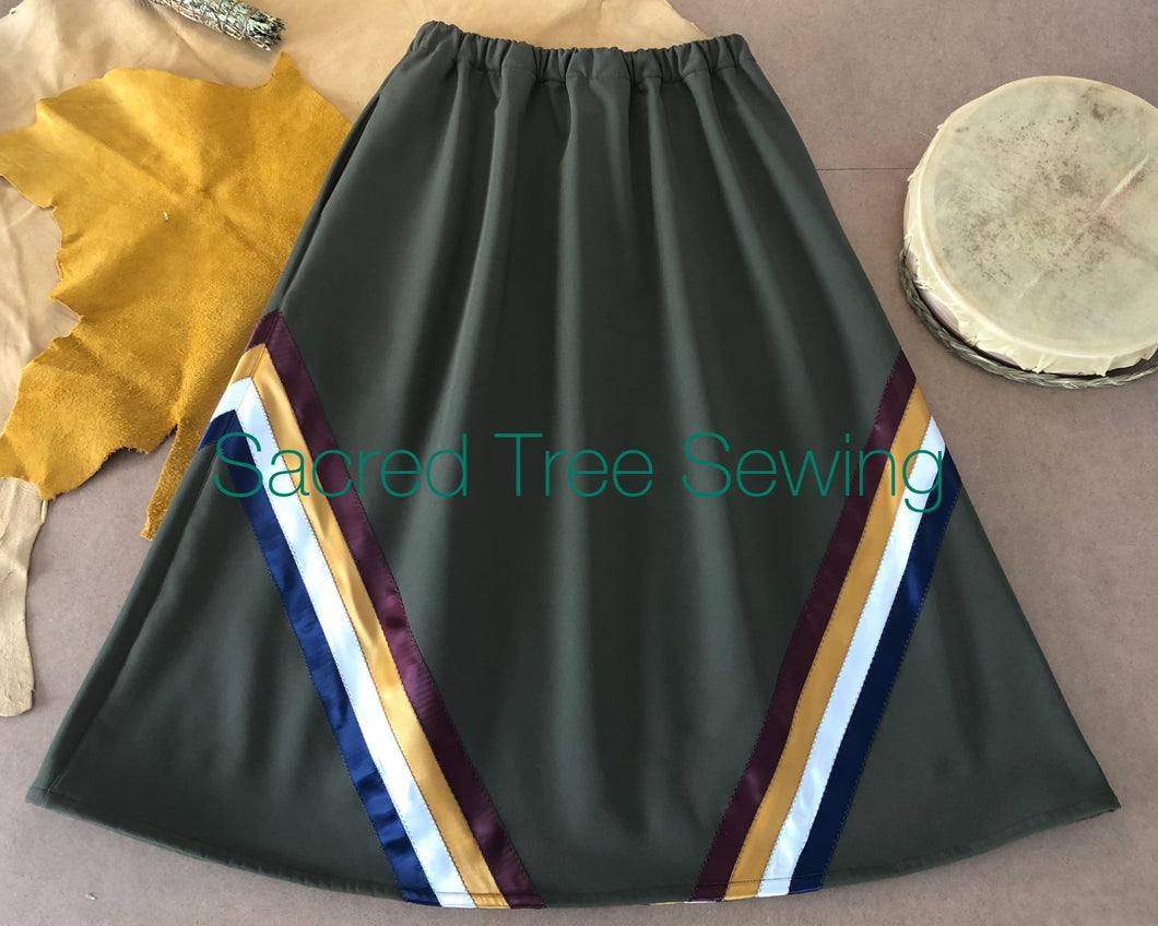 Green rain skirt with maroon, gold, white and navy ribbons