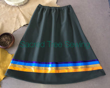 Load image into Gallery viewer, Green Rain skirt with orange, gold, royal blue and dark purple ribbons
