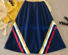 Load image into Gallery viewer, Blue rain skirt with red, black, white and gold ribbons
