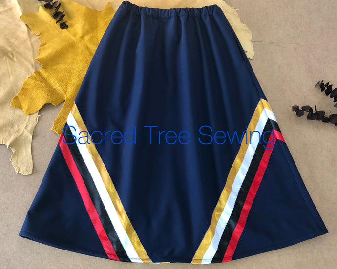 Blue rain skirt with red, black, white and gold ribbons