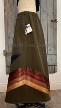 Load image into Gallery viewer, Pocket view Green rain skirt fabric with two appliquéd eagles with golden and brown ribbons
